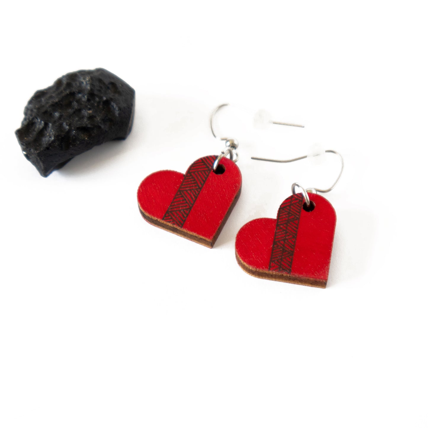 Small red unique wooden earrings in the shape of a heart