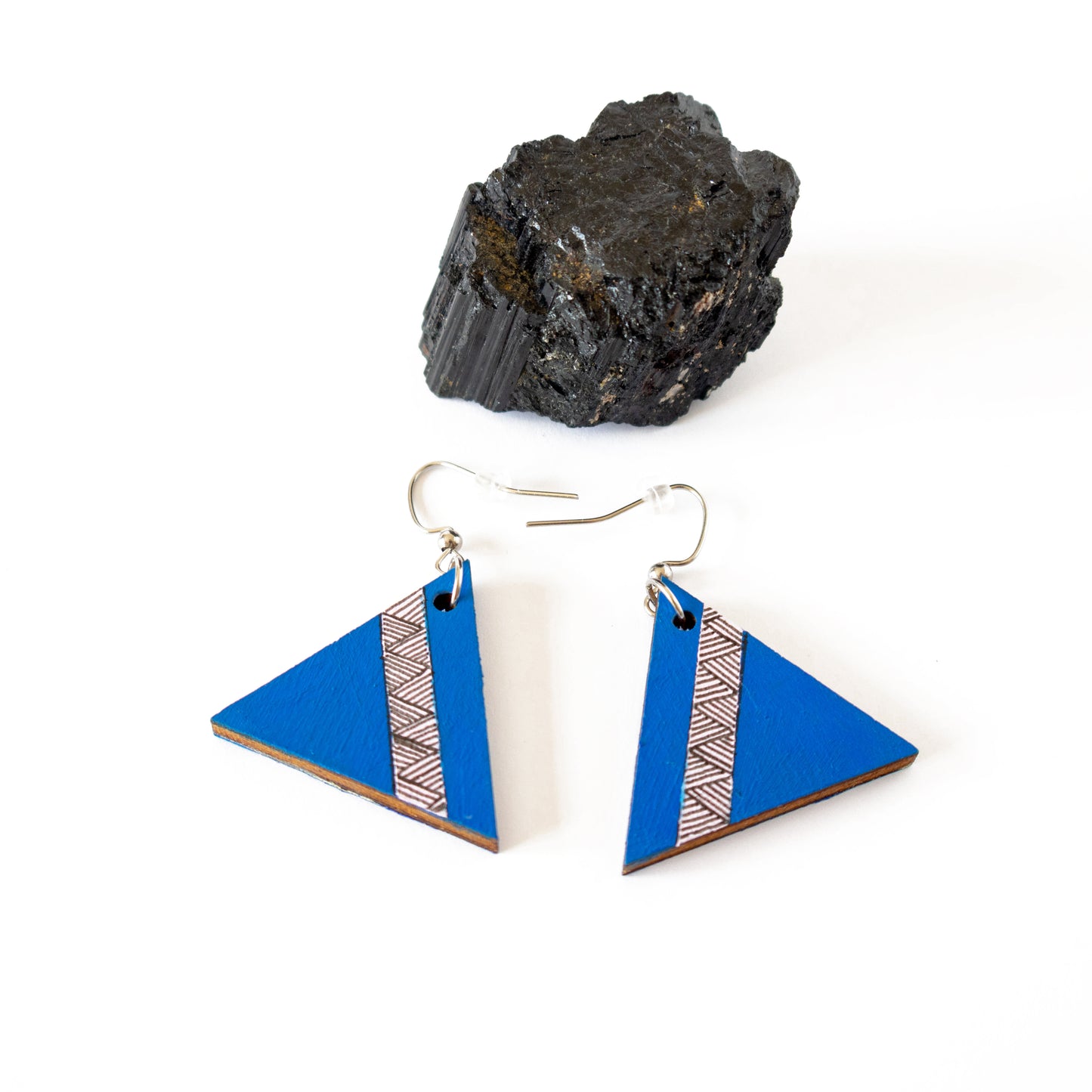 Unique blue wooden earrings in the shape of a triangle