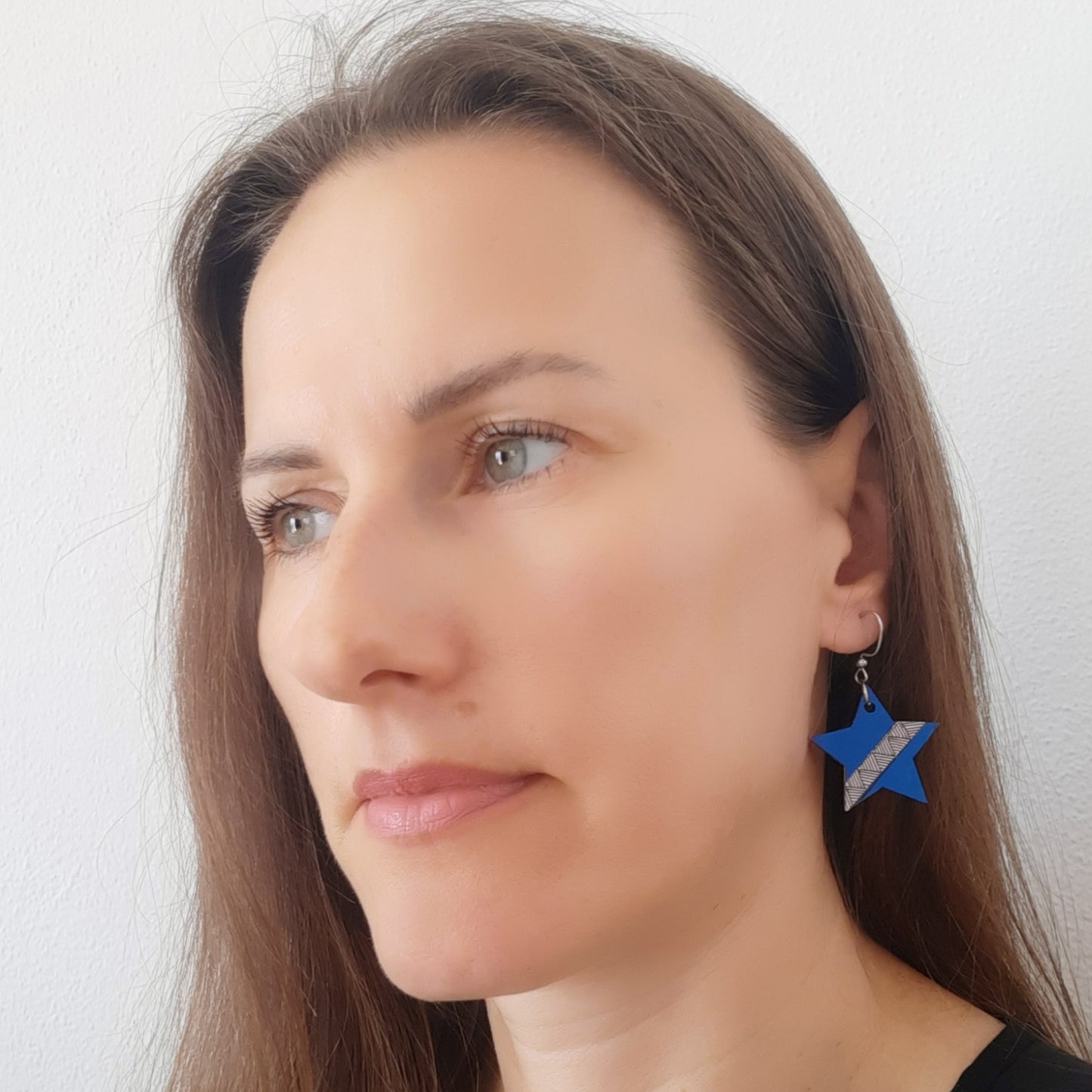 Blue unique wooden earrings in the shape of a star