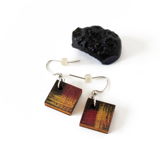 Unique small black earrings with red and gold details