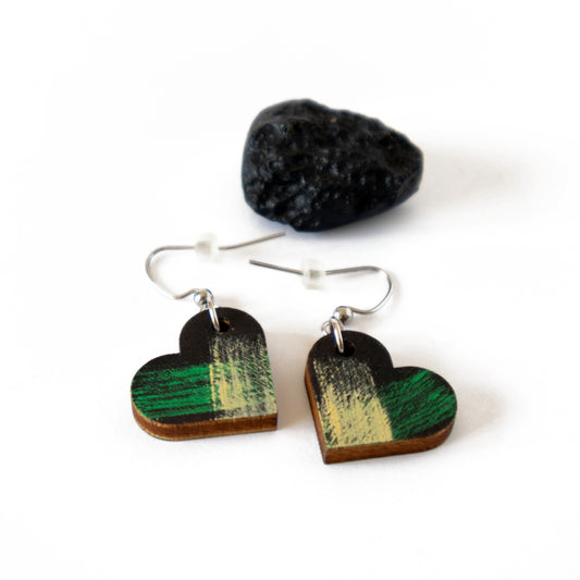 Unique black heart-shaped earrings with green and yellow details