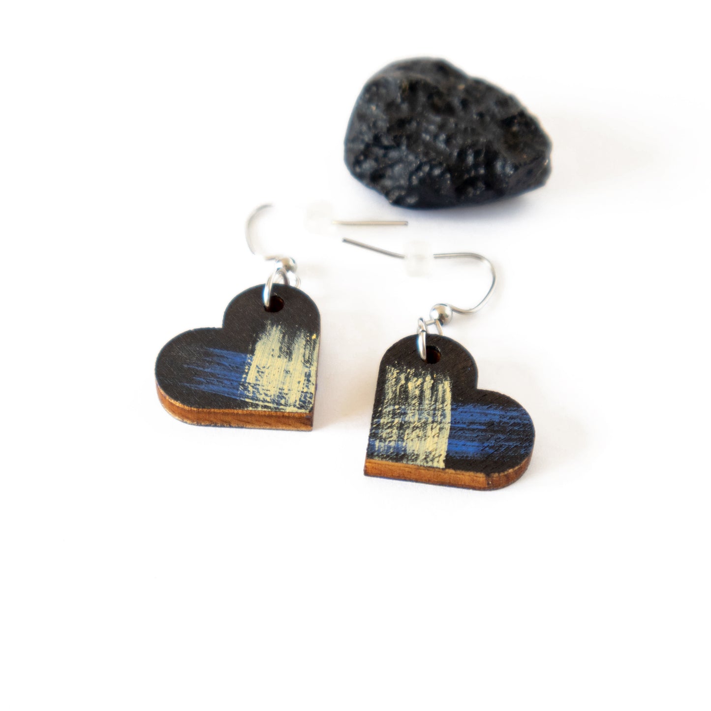 Unique black heart-shaped earrings with blue and yellow details