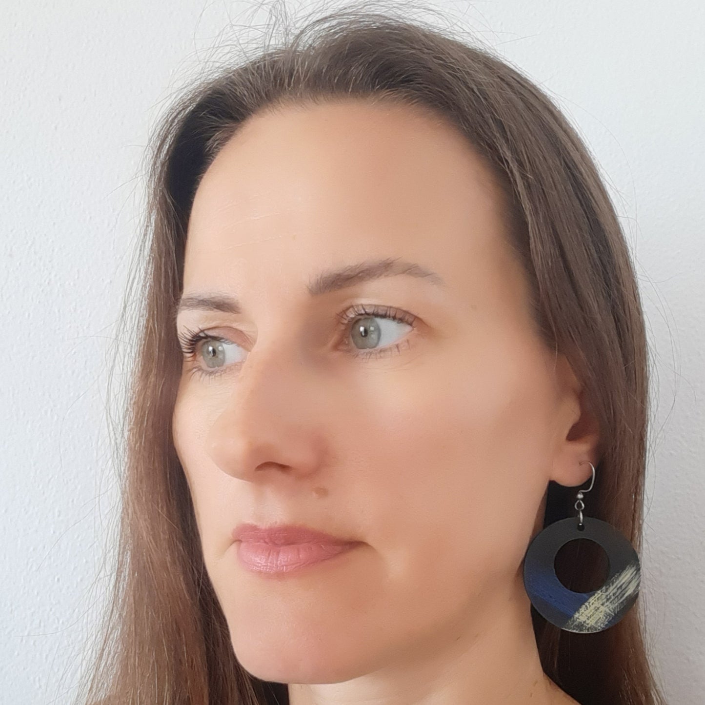 Unique light black wooden earrings with blue and yellow details