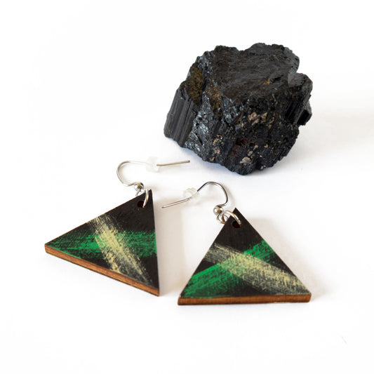 Black wooden earrings in the shape of a triangle with green and yellow details