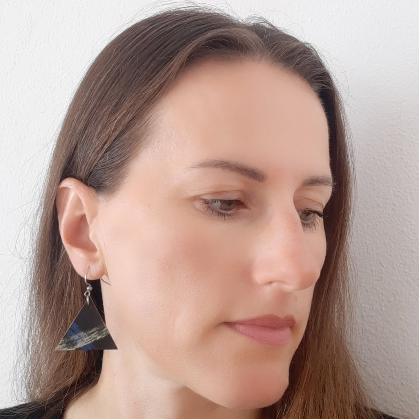 Black wooden earrings with blue and yellow details