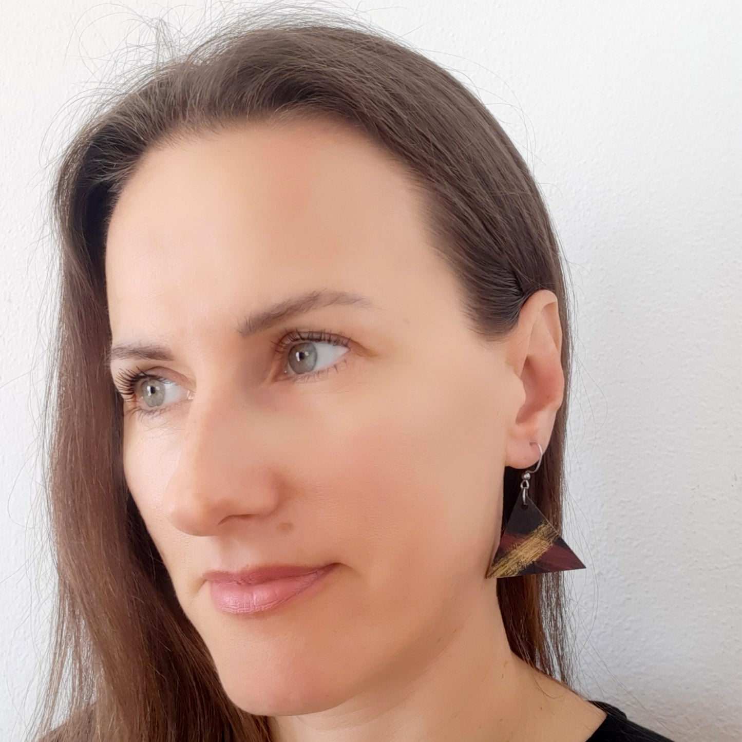 Unique black wooden triangle earrings with red and gold details