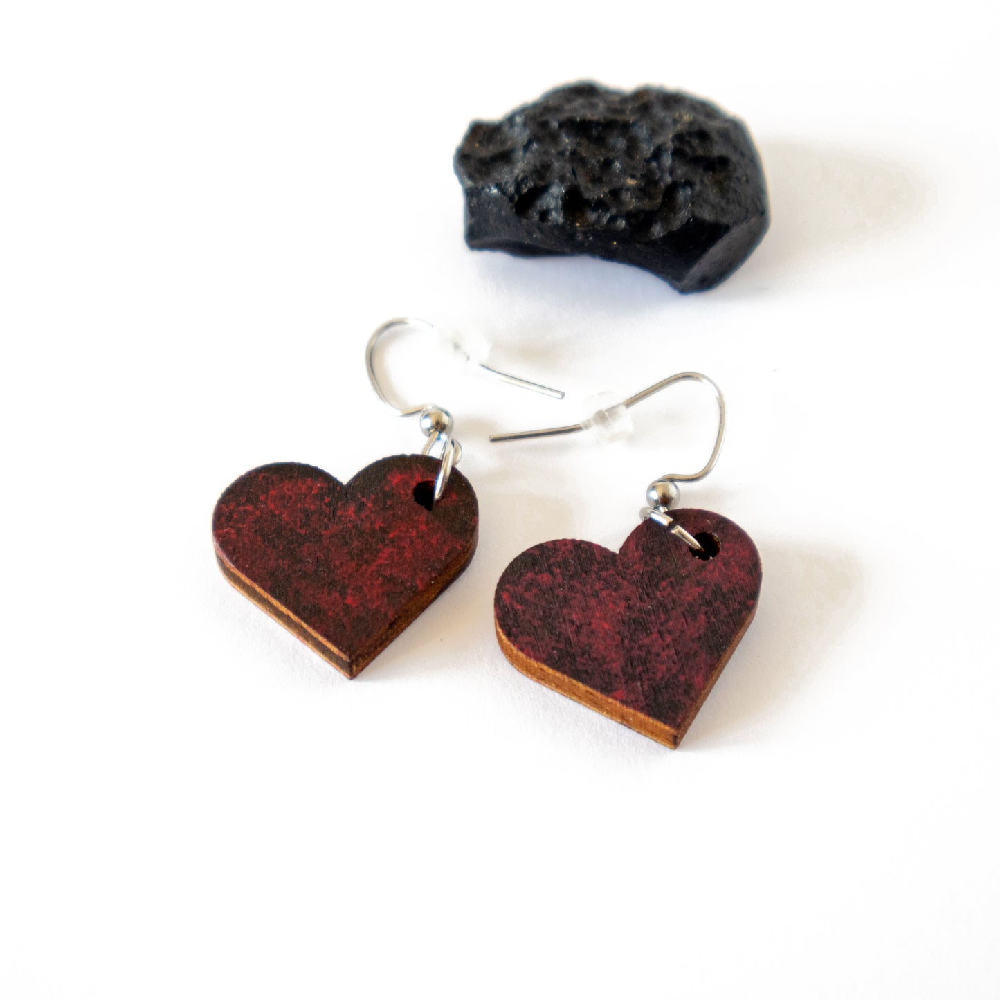 Unique black heart-shaped earrings with red details