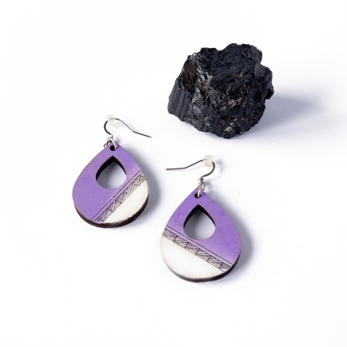 Unique wooden earrings in lavender color in the shape of a teardrop